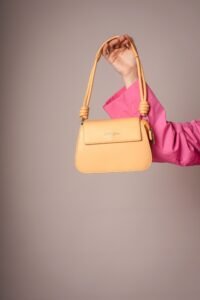 How to Choose the Right Handbag woman holding a stylish handbag for everyday use