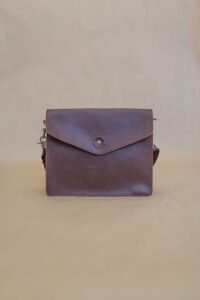brown leather handbag on a white background