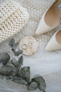 Best Handbags for Wedding Guests elegant pearl clutch with wedding accessories